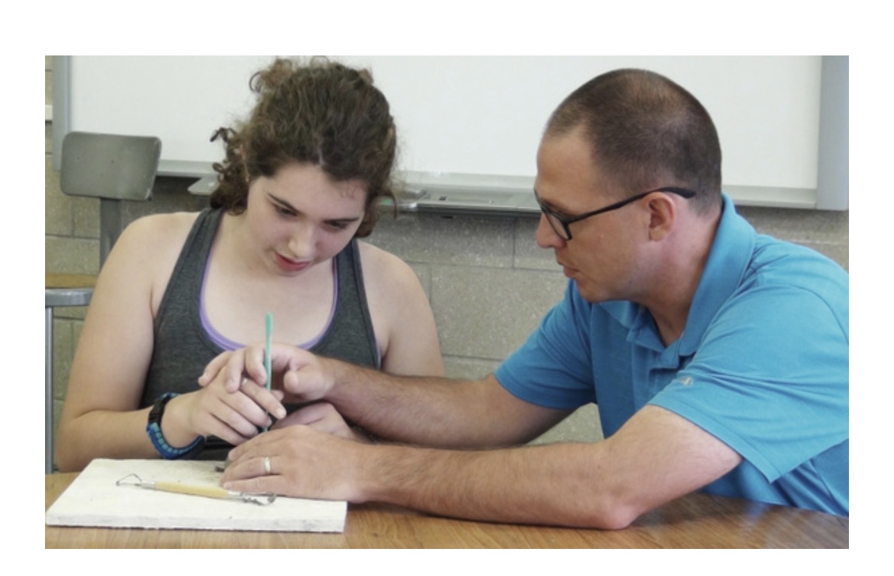 One-on-one coaching session in a program setting