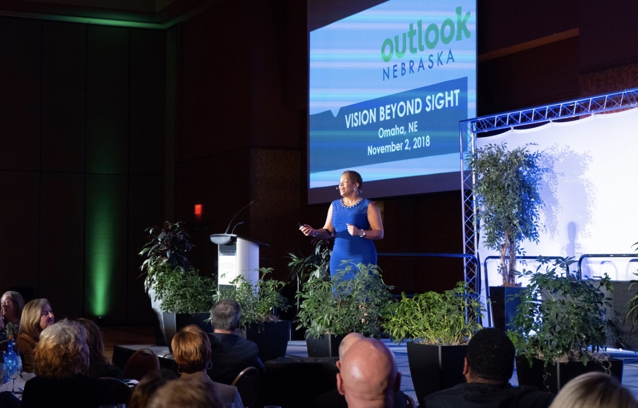 Speaker presenting at an Outlook Nebraska event